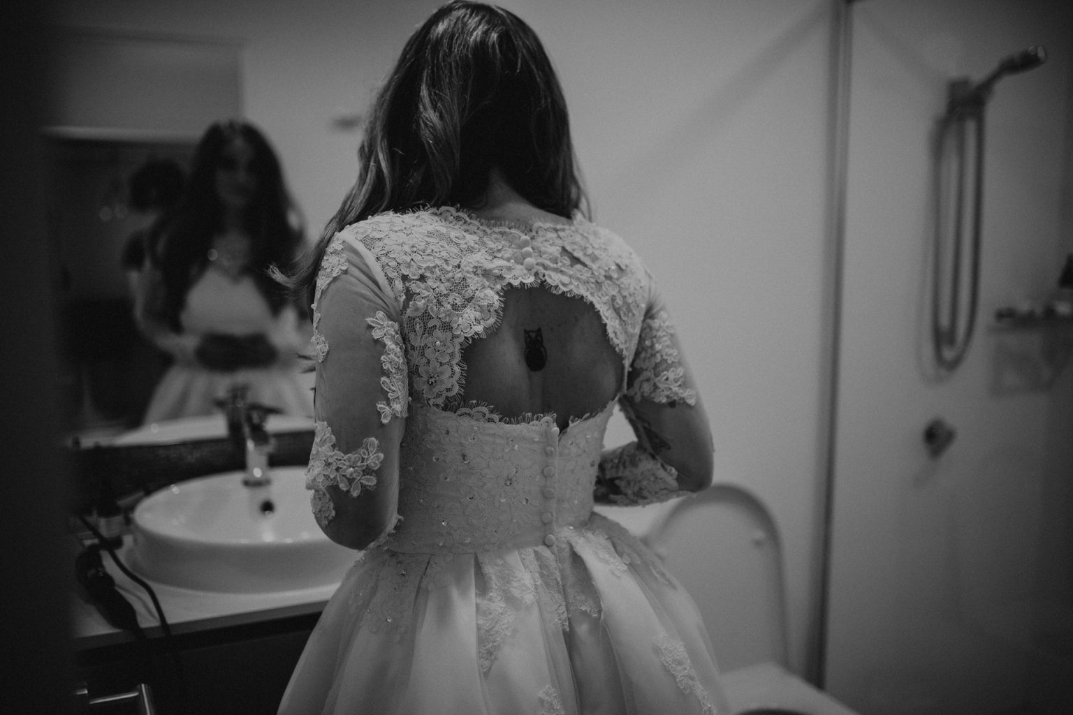 bride looking in mirror tattoo