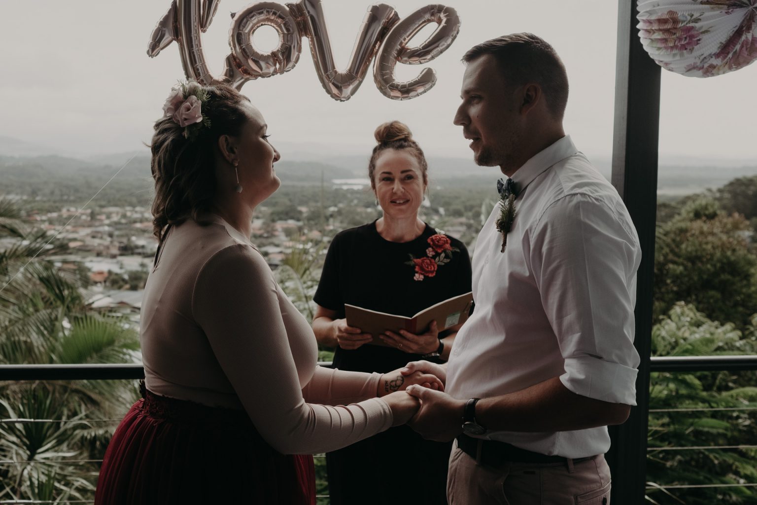 bride and groom on back deck private elopement vows
