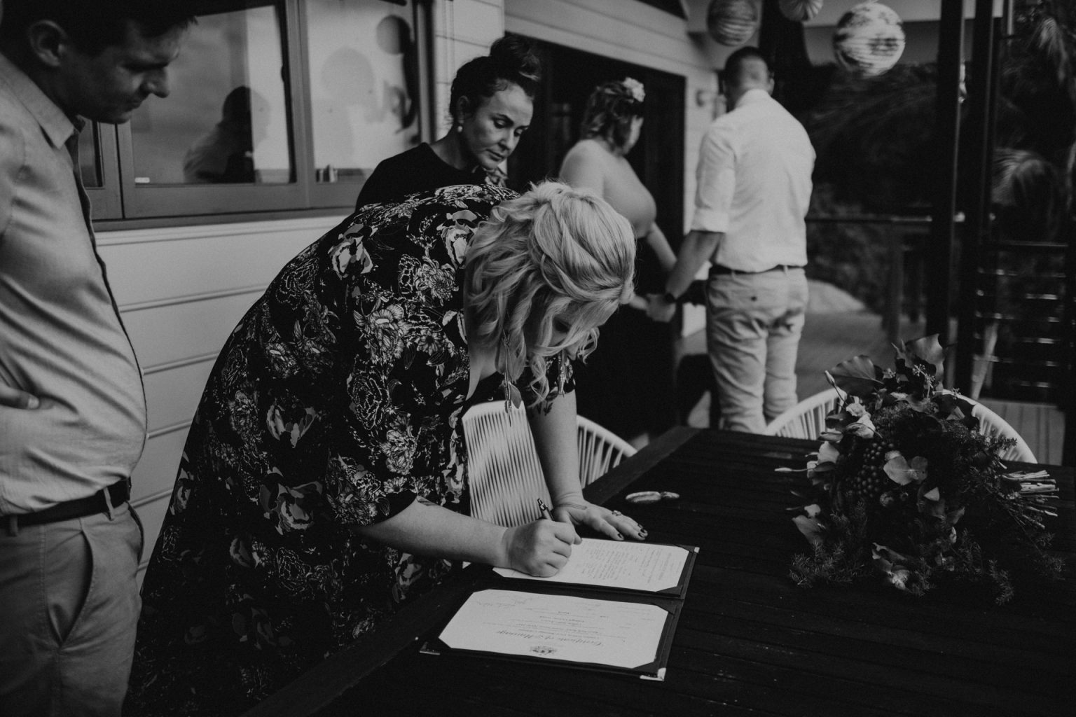 woman signing papers