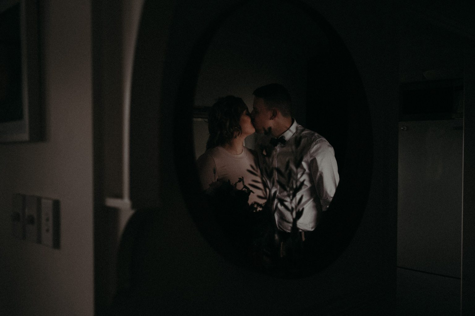 bride and groom in mirror