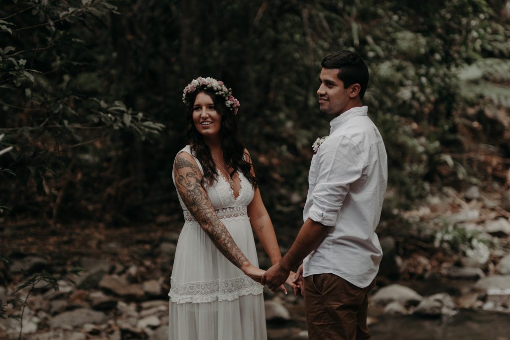 bride and groom eloping in forest brunette
