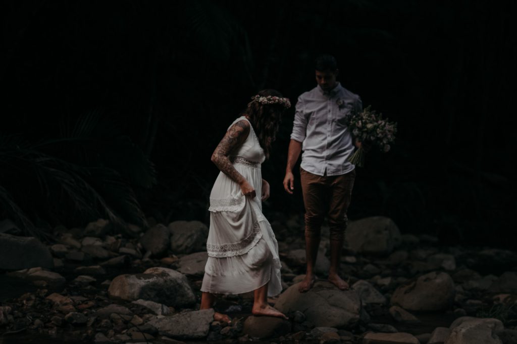 bride and groom walking in forest cougar cascades currumbin