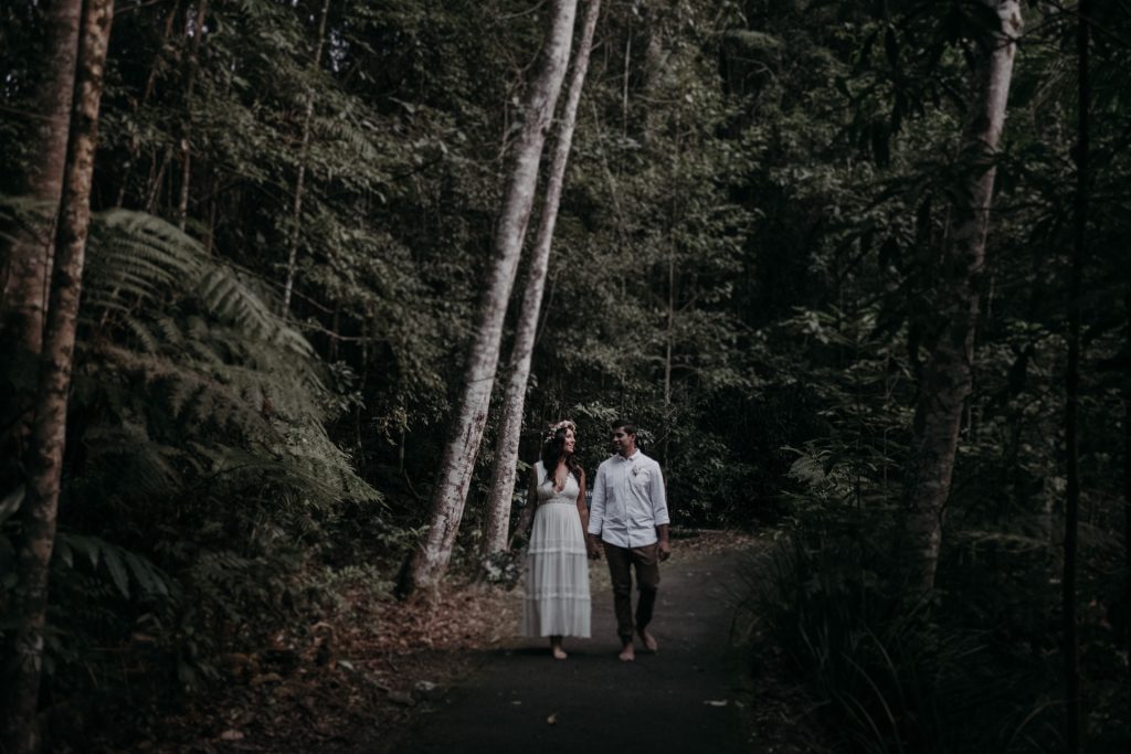 bride and groom walking in forest cougar cascades currumbin 