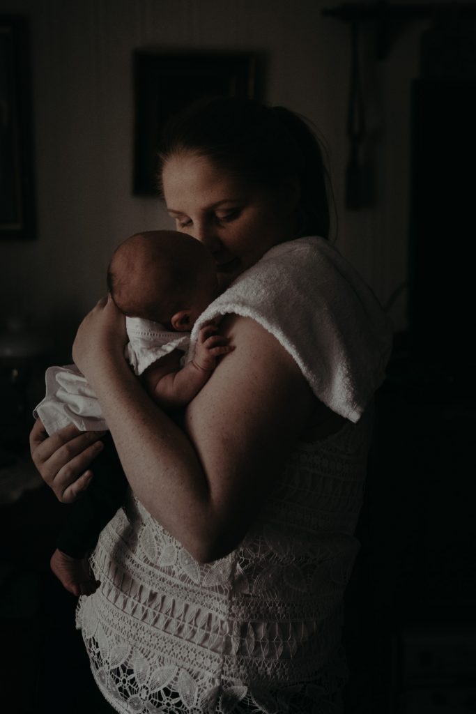 woman holding newborn 