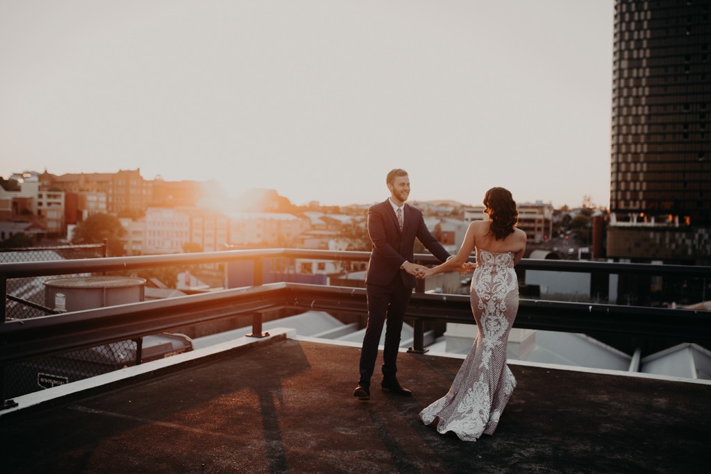 bride and groom dancing on rooftop for New York style elopement in Fortitude Valley Brisbane sunset