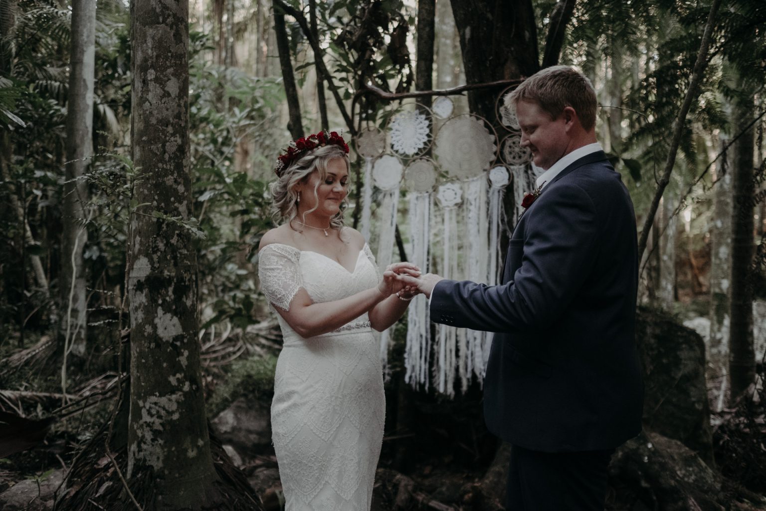 bride and groom at forest alter elopement ceremony