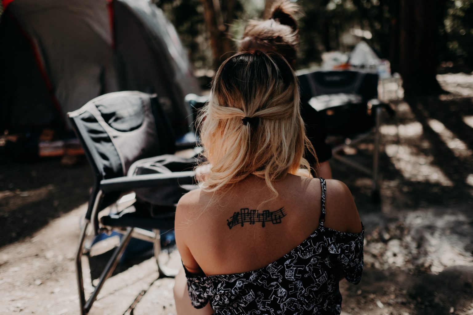 woman with tattoo back